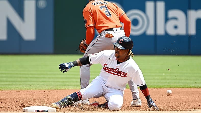 Aug 7, 2022; Cleveland, Ohio, USA; Cleveland Guardians third baseman Jose Ramirez (11) slides into second with a double as Houston Astros shortstop Jeremy Pena (3) waits for the ball during the first inning at Progressive Field. Mandatory Credit: Ken Blaze-USA TODAY Sports