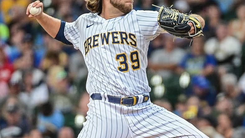Aug 7, 2022; Milwaukee, Wisconsin, USA; Milwaukee Brewers pitcher Corbin Burnes (39) throws a pitch in the first inning against the Cincinnati Reds at American Family Field. Mandatory Credit: Benny Sieu-USA TODAY Sports