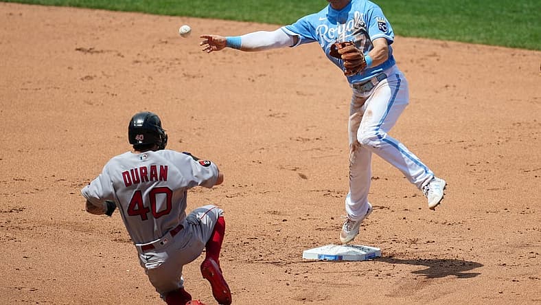 Aug 7, 2022; Kansas City, Missouri, USA; Kansas City Royals shortstop Bobby Witt Jr. (7) throws to first base after forcing out Boston Red Sox center fielder Jarren Duran (40) during the fifth inning at Kauffman Stadium. Mandatory Credit: Jay Biggerstaff-USA TODAY Sports
