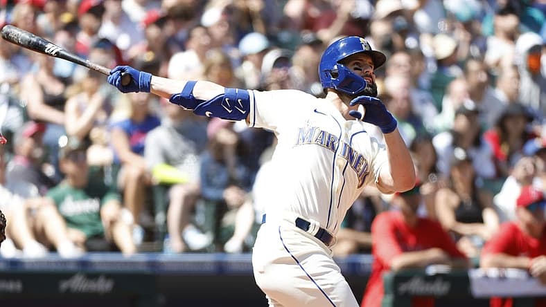 Aug 7, 2022; Seattle, Washington, USA; Seattle Mariners left fielder Jesse Winker (27) hits a grand-slam home run against the Los Angeles Angels during the third inning at T-Mobile Park. Mandatory Credit: Joe Nicholson-USA TODAY Sports
