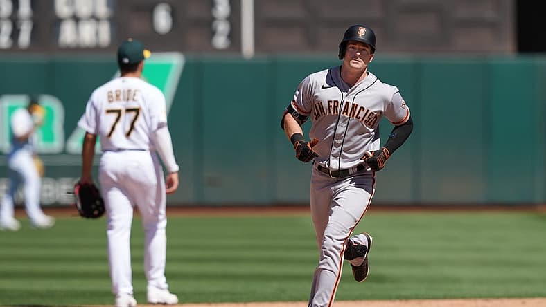 Aug 7, 2022; Oakland, California, USA; San Francisco Giants center fielder Mike Yastrzemski (5) rounds the bases after hitting a home run against the Oakland Athletics during the eighth inning at RingCentral Coliseum. Mandatory Credit: Darren Yamashita-USA TODAY Sports