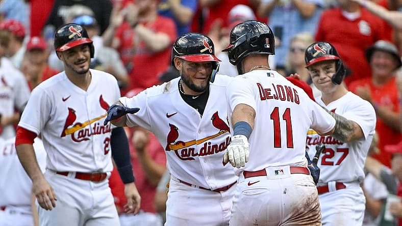 Aug 7, 2022; St. Louis, Missouri, USA;  St. Louis Cardinals shortstop Paul DeJong (11) is congratulated by catcher Yadier Molina (4) after hitting a three run home run against the New York Yankees during the eighth inning at Busch Stadium. Mandatory Credit: Jeff Curry-USA TODAY Sports