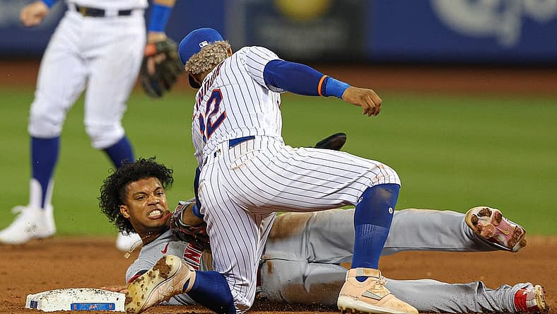Aug 8, 2022; New York City, New York, USA; Cincinnati Reds shortstop Jose Barrero (2) steals second base as New York Mets shortstop Francisco Lindor (12) tags during the fifth inning at Citi Field. Mandatory Credit: Vincent Carchietta-USA TODAY Sports