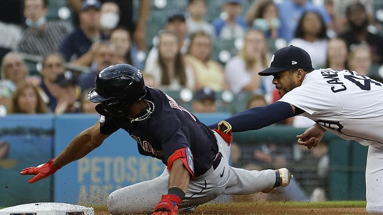Aug 9, 2022; Detroit, Michigan, USA;  Cleveland Guardians shortstop Amed Rosario (1) is tagged out at third by Detroit Tigers third baseman Jeimer Candelario (46) in the fourth inning at Comerica Park. Mandatory Credit: Rick Osentoski-USA TODAY Sports