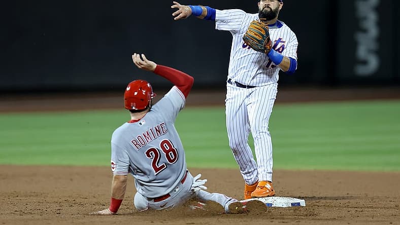 Aug 9, 2022; New York City, New York, USA; New York Mets second baseman Luis Guillorme (13) forces out Cincinnati Reds catcher Austin Romine (28) at second and throws to first to attempt a double play on a ball hit by Reds center fielder Nick Senzel (not pictured) during the third inning at Citi Field. Senzel was safe at first. Mandatory Credit: Brad Penner-USA TODAY Sports