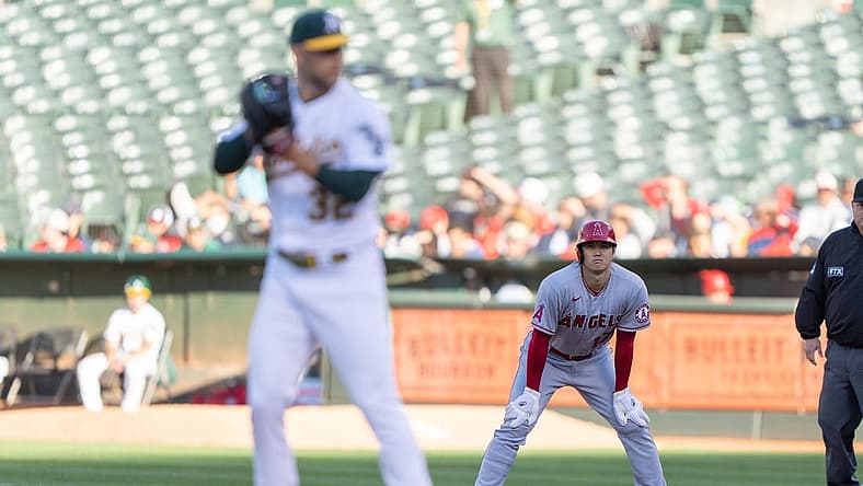Aug 9, 2022; Oakland, California, USA; Los Angeles Angels starting pitcher Shohei Ohtani (17) watches Oakland Athletics starting pitcher James Kaprielian (32) during the first inning at RingCentral Coliseum. Mandatory Credit: Stan Szeto-USA TODAY Sports