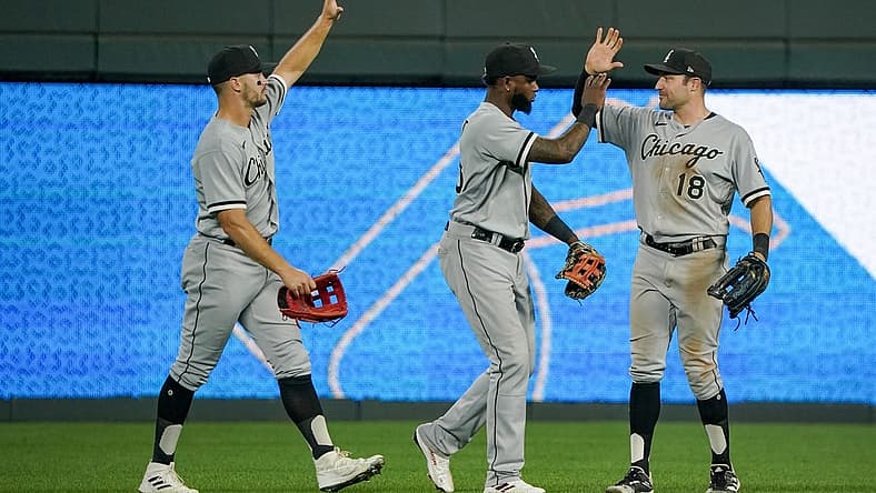 Aug 9, 2022; Kansas City, Missouri, USA; Chicago White Sox center fielder Adam Engel (15) and right fielder AJ Pollock (18) and center fielder Luis Robert (88) celebrate against the Kansas City Royals after a game at Kauffman Stadium. Mandatory Credit: Denny Medley-USA TODAY Sports