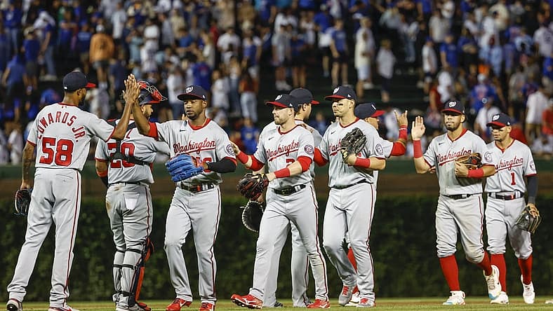 Aug 9, 2022; Chicago, Illinois, USA; Washington Nationals players celebrate after defeating the Chicago Cubs at Wrigley Field. Mandatory Credit: Kamil Krzaczynski-USA TODAY Sports