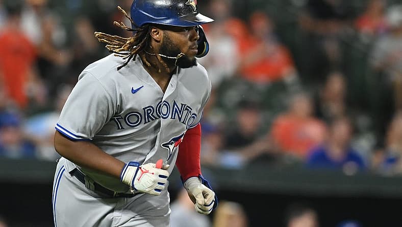 Aug 9, 2022; Baltimore, Maryland, USA; Toronto Blue Jays first baseman Vladimir Guerrero Jr. (27) runs out a sixth inning single against the Baltimore Orioles at Oriole Park at Camden Yards. Mandatory Credit: Tommy Gilligan-USA TODAY Sports