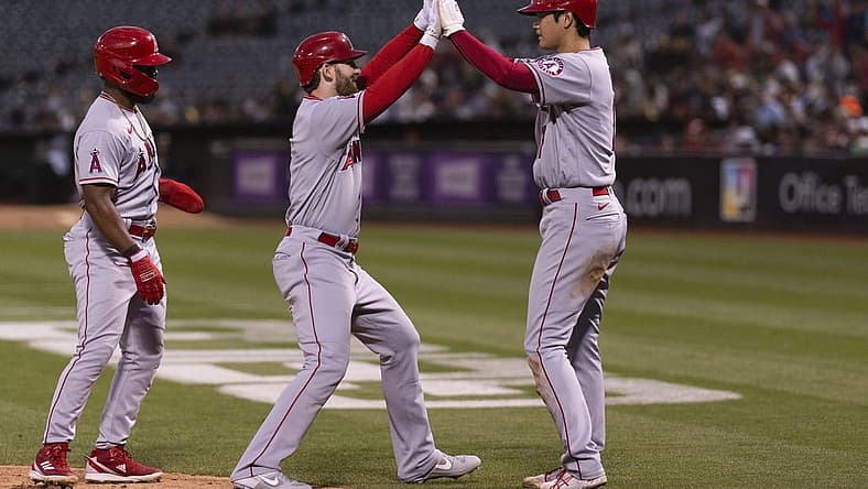 Aug 9, 2022; Oakland, California, USA; Los Angeles Angels starting pitcher Shohei Ohtani (17) celebrates with Los Angeles Angels right fielder Taylor Ward (3) after hitting a three run homerun during the fifth inning against the Oakland Athletics at RingCentral Coliseum. Mandatory Credit: Stan Szeto-USA TODAY Sports