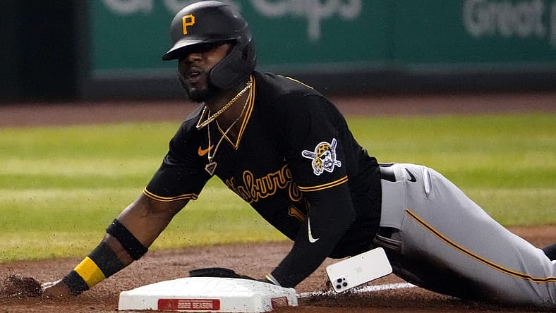 Aug 9, 2022; Phoenix, Arizona, USA; Pittsburgh Pirates second baseman Rodolfo Castro (14) loses his iPhone mobile cell phone as he slides into third base against the Arizona Diamondbacks during the fourth inning at Chase Field. Mandatory Credit: Joe Camporeale-USA TODAY Sports