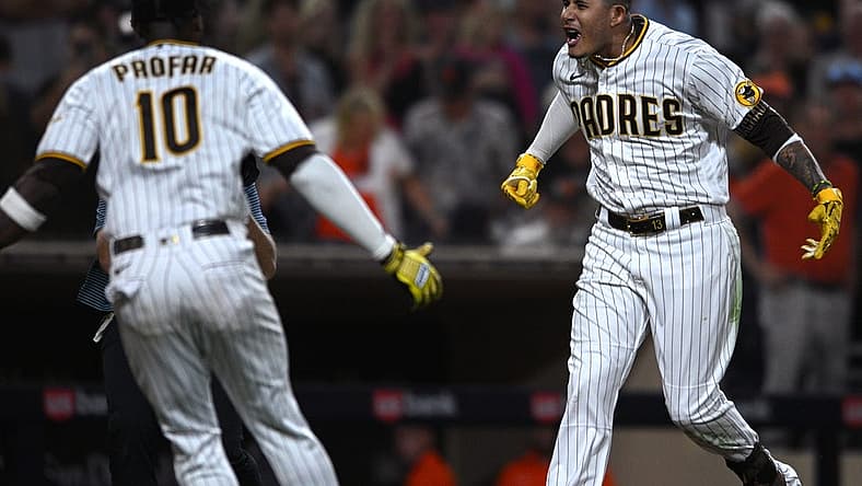 Aug 9, 2022; San Diego, California, USA; San Diego Padres third baseman Manny Machado (right) celebrates with left fielder Jurickson Profar (10) after hitting a walk-off three-run home run against the San Francisco Giants at Petco Park. Mandatory Credit: Orlando Ramirez-USA TODAY Sports