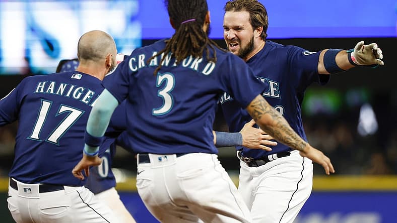 Aug 9, 2022; Seattle, Washington, USA; Seattle Mariners pinch hitter Luis Torrens (22) celebrates after hitting a walk-off RBI-single against the New York Yankees during the thirteenth inning at T-Mobile Park. Seattle defeated New York, 1-0. Mandatory Credit: Joe Nicholson-USA TODAY Sports