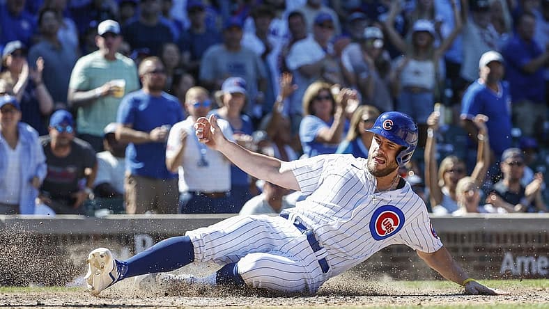 Aug 10, 2022; Chicago, Illinois, USA; Chicago Cubs third baseman Patrick Wisdom (16) scores against the Washington Nationals during the seventh inning at Wrigley Field. Mandatory Credit: Kamil Krzaczynski-USA TODAY Sports