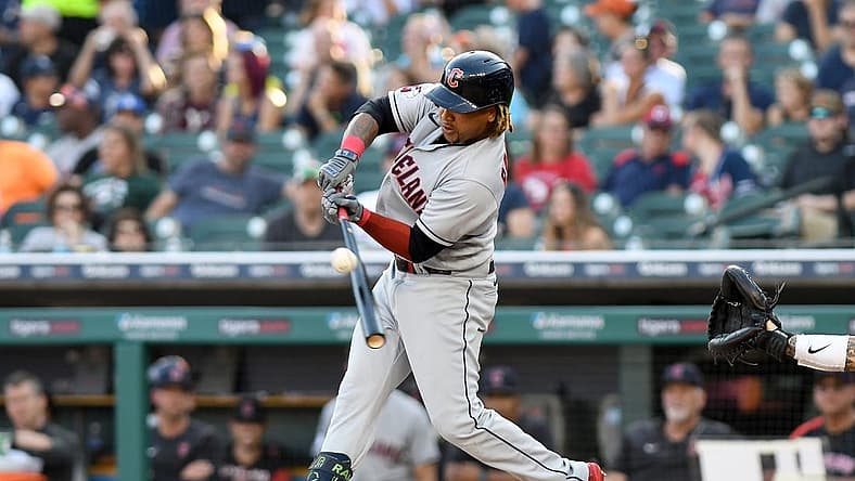 Aug 10, 2022; Detroit, Michigan, USA; Cleveland Guardians third baseman Jose Ramirez (11) hits a RBI single off Detroit Tigers starting pitcher Drew Hutchison (not pictured) in the first inning at Comerica Park. Mandatory Credit: Lon Horwedel-USA TODAY Sports