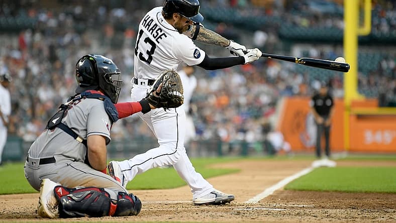 Aug 10, 2022; Detroit, Michigan, USA; Detroit Tigers catcher Eric Haase (13) hits an RBI double off Cleveland Guardians starting pitcher Aaron Civale (not pictured) in the fourth inning at Comerica Park. Mandatory Credit: Lon Horwedel-USA TODAY Sports