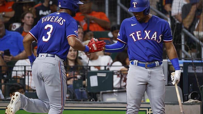 Aug 10, 2022; Houston, Texas, USA; Texas Rangers center fielder Leody Taveras (3) celebrates with third baseman Ezequiel Duran (70) after scoring a run during the fourth inning against the Houston Astros at Minute Maid Park. Mandatory Credit: Troy Taormina-USA TODAY Sports
