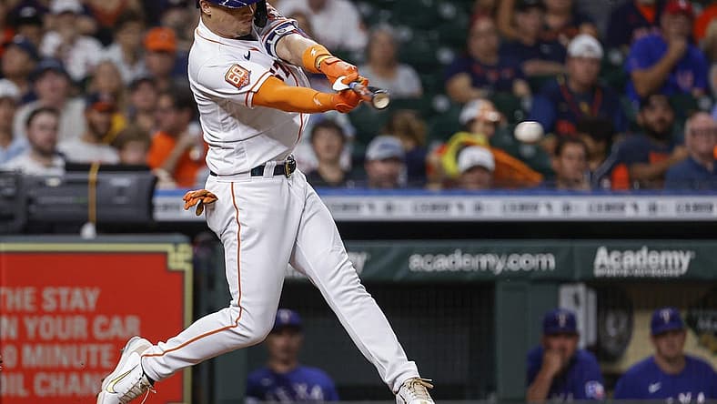 Aug 10, 2022; Houston, Texas, USA; Houston Astros pinch hitter Aledmys Diaz (16) hits a single during the eighth inning against the Texas Rangers at Minute Maid Park. Mandatory Credit: Troy Taormina-USA TODAY Sports