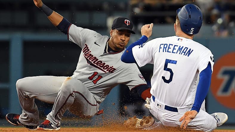 Aug 10, 2022; Los Angeles, California, USA;  Los Angeles Dodgers first baseman Freddie Freeman (5) is out against Minnesota Twins second baseman Jorge Polanco (11) after an attempt to steal second in the third inning at Dodger Stadium. Mandatory Credit: Richard Mackson-USA TODAY Sports