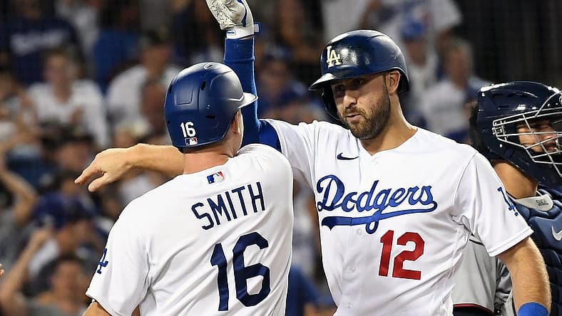 Aug 10, 2022; Los Angeles, California, USA; Los Angeles Dodgers right fielder Joey Gallo (12) celebrates with catcher Will Smith (16) after hitting a three run home run in the seventh inning against the Minnesota Twins at Dodger Stadium. Mandatory Credit: Richard Mackson-USA TODAY Sports