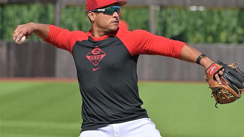 Aug 11, 2022; Dyersville, Iowa, USA; Cincinnati Reds designated hitter Donovan Solano (7) warms up before the game against the Chicago Cubs at Field of Dreams. Mandatory Credit: Jeffrey Becker-USA TODAY Sports
