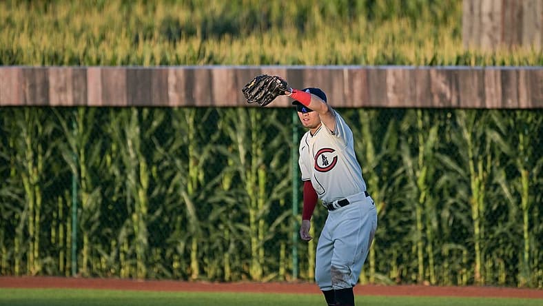 Aug 11, 2022; Dyersville, Iowa, USA; Chicago Cubs right fielder Seiya Suzuki (27) shields his eyes against the Cincinnati Reds during the third inning at Field of Dreams. Mandatory Credit: Jeffrey Becker-USA TODAY Sports