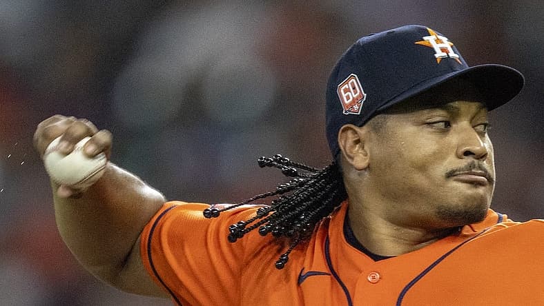 Aug 12, 2022; Houston, Texas, USA; Houston Astros starting pitcher Luis Garcia (77) pitches against the Oakland Athletics in the second inning at Minute Maid Park. Mandatory Credit: Thomas Shea-USA TODAY Sports