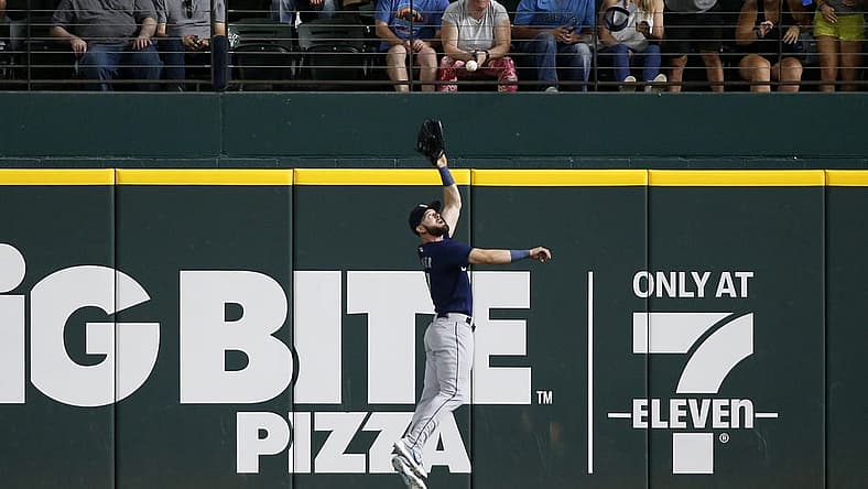 Aug 12, 2022; Arlington, Texas, USA; Seattle Mariners right fielder Mitch Haniger (17) catches a fly ball hit by Texas Rangers center fielder Leody Taveras (not pictured) in the second inning at Globe Life Field. Mandatory Credit: Tim Heitman-USA TODAY Sports