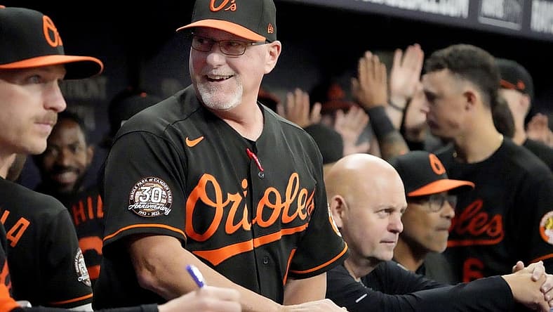 Aug 12, 2022; St. Petersburg, Florida, USA; Baltimore Orioles manager Brandon Hyde (18) reacts after his team scored in the sixth inning against the Tampa Bay Rays at Tropicana Field. Mandatory Credit: Dave Nelson-USA TODAY Sports