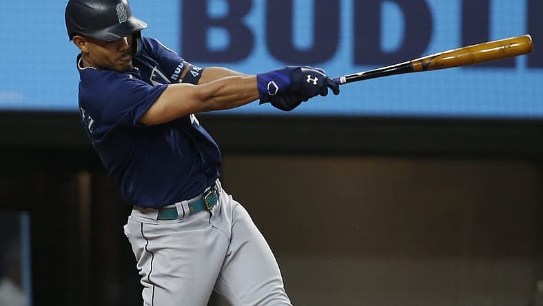 Aug 12, 2022; Arlington, Texas, USA; Seattle Mariners center fielder Julio Rodriguez (44) singles in two runs in the fourth inning against the Texas Rangers at Globe Life Field. Mandatory Credit: Tim Heitman-USA TODAY Sports