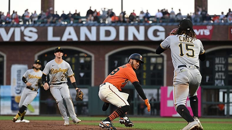 Aug 12, 2022; San Francisco, California, USA; San Francisco Giants second baseman Thairo Estrada (39) is caught in a rundown between Pittsburgh Pirates second baseman Kevin Newman (27) and shortstop Oneil Cruz (15) during the second inning at Oracle Park. Mandatory Credit: Robert Edwards-USA TODAY Sports