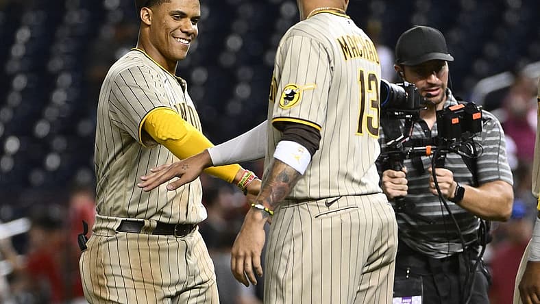 Aug 12, 2022; Washington, District of Columbia, USA; San Diego Padres right fielder Juan Soto (22) celebrates with third baseman Manny Machado (13) after the game against the Washington Nationals at Nationals Park. Mandatory Credit: Brad Mills-USA TODAY Sports