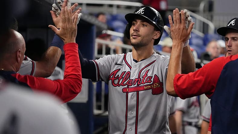 Aug 13, 2022; Miami, Florida, USA; Atlanta Braves first baseman Matt Olson (28) celebrates in the dugout with teammates after hitting a solo home run in the fifth inning against the Miami Marlins at loanDepot park. Mandatory Credit: Jasen Vinlove-USA TODAY Sports