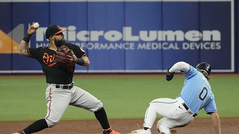 Aug 13, 2022; St. Petersburg, Florida, USA; Baltimore Orioles second baseman Rougned Odor (12) makes the force out at second on Tampa Bay Rays shortstop Taylor Walls (0) in the third inning at Tropicana Field. Mandatory Credit: Dave Nelson-USA TODAY Sports