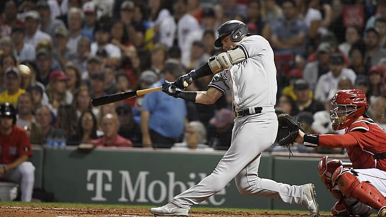 Aug 13, 2022; Boston, Massachusetts, USA; New York Yankees third baseman Josh Donaldson (28) hits a single during the fourth inning against the Boston Red Sox at Fenway Park. Mandatory Credit: Bob DeChiara-USA TODAY Sports