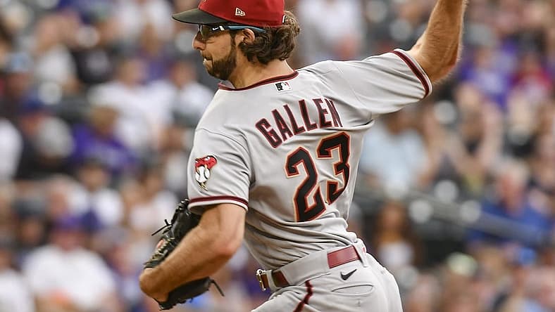 Aug 13, 2022; Denver, Colorado, USA; Arizona Diamondbacks starting pitcher Zac Gallen (23) delivers a pitch in the first inning against the Colorado Rockies at Coors Field. Mandatory Credit: John Leyba-USA TODAY Sports
