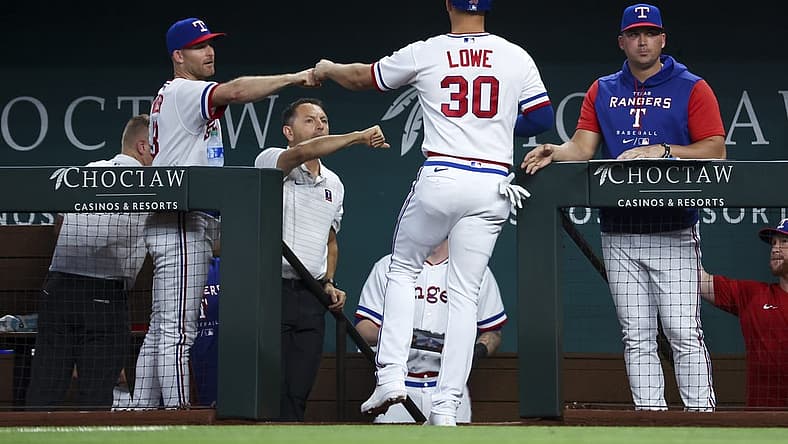 Aug 13, 2022; Arlington, Texas, USA;  Texas Rangers first baseman Nathaniel Lowe (30) celebrates with teammates after scoring during the fourth inning against the Seattle Mariners at Globe Life Field. Mandatory Credit: Kevin Jairaj-USA TODAY Sports