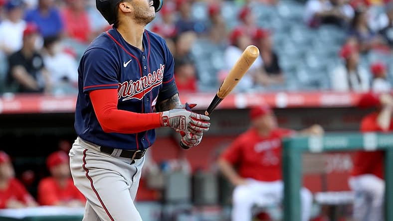 Aug 13, 2022; Anaheim, California, USA; Minnesota Twins shortstop Carlos Correa (4) hits a home run in the first inning against the Los Angeles Angels at Angel Stadium. Mandatory Credit: Kiyoshi Mio-USA TODAY Sports