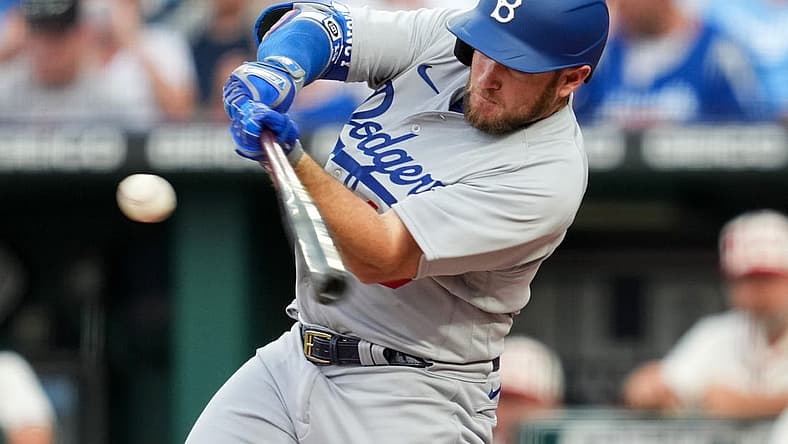 Aug 13, 2022; Kansas City, Missouri, USA; Los Angeles Dodgers third baseman Max Muncy (13) hits a home run against the Kansas City Royals during the fourth inning at Kauffman Stadium. Mandatory Credit: Jay Biggerstaff-USA TODAY Sports