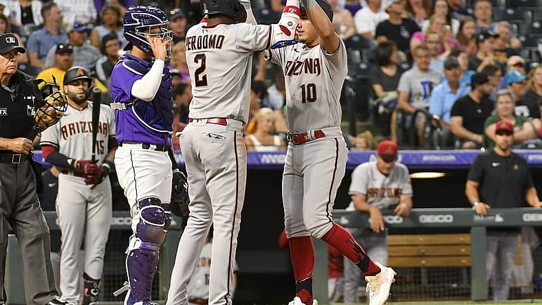 Aug 13, 2022; Denver, Colorado, USA; Arizona Diamondbacks shortstop Geraldo Perdomo (2) high fives Arizona Diamondbacks third baseman Josh Rojas (10) after his home run in the fifth inning against the Colorado Rockies at Coors Field. Mandatory Credit: John Leyba-USA TODAY Sports