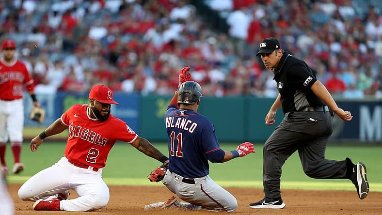 Aug 13, 2022; Anaheim, California, USA;  Minnesota Twins second baseman Jorge Polanco (11) tagged out by Los Angeles Angels second baseman Luis Rengifo (2) at second during the fourth inning at Angel Stadium. Mandatory Credit: Kiyoshi Mio-USA TODAY Sports
