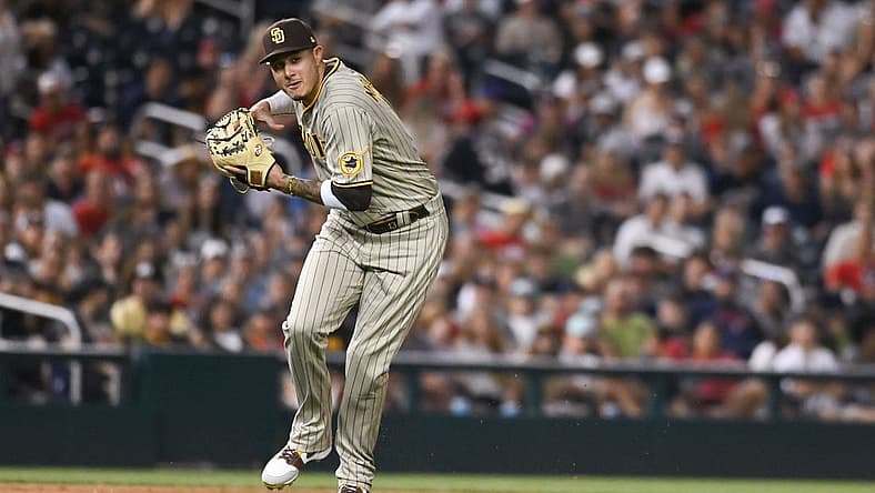 Aug 13, 2022; Washington, District of Columbia, USA; San Diego Padres third baseman Manny Machado (13) looks to throw to first base during the eighth inning against the Washington Nationals at Nationals Park. Mandatory Credit: Tommy Gilligan-USA TODAY Sports