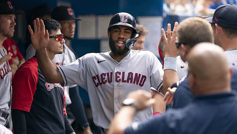 Aug 14, 2022; Toronto, Ontario, CAN; Cleveland Guardians shortstop Amed Rosario (1) celebrates in the dugout after scoring a run against the Toronto Blue Jays during the fifth inning at Rogers Centre. Mandatory Credit: Nick Turchiaro-USA TODAY Sports