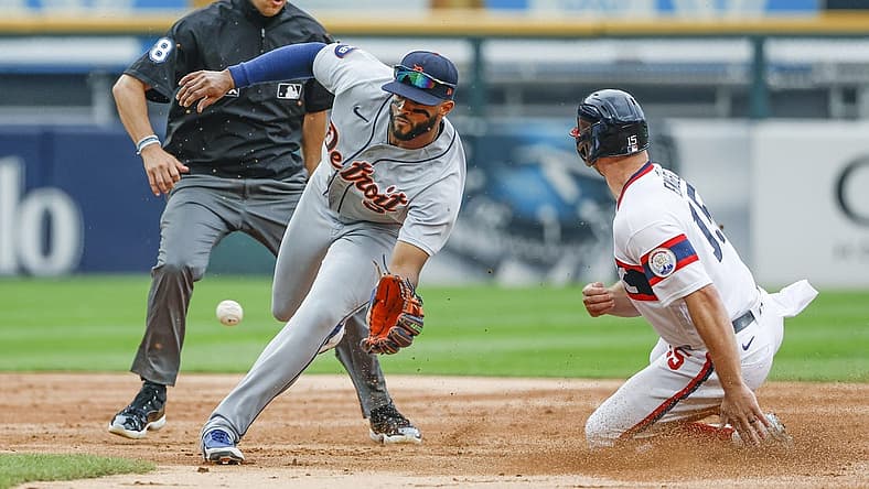 Aug 14, 2022; Chicago, Illinois, USA; Chicago White Sox center fielder Adam Engel (15) steals second base as Detroit Tigers right fielder Willi Castro (9) waits for the ball during the second inning at Guaranteed Rate Field. Mandatory Credit: Kamil Krzaczynski-USA TODAY Sports