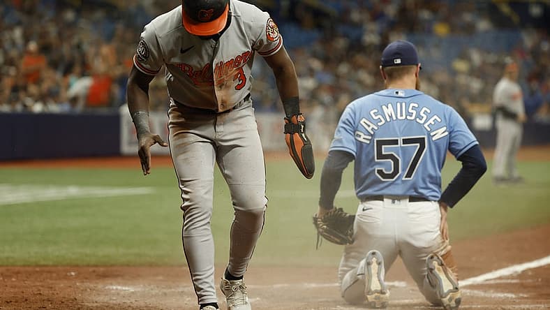 Aug 14, 2022; St. Petersburg, Florida, USA; Baltimore Orioles shortstop Jorge Mateo (3) scores a run on a wild pitch by Tampa Bay Rays starting pitcher Drew Rasmussen (57) during the ninth inning at Tropicana Field. Mandatory Credit: Kim Klement-USA TODAY Sports