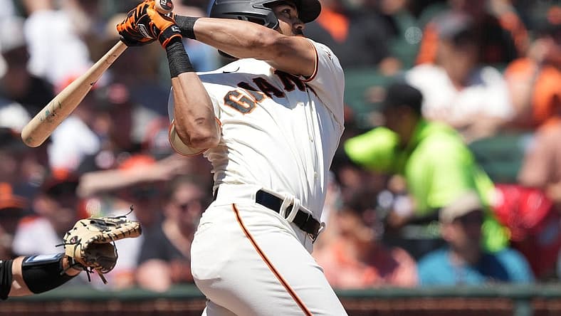 Aug 14, 2022; San Francisco, California, USA; San Francisco Giants right fielder LaMonte Wade Jr. (31) hits a home run against the Pittsburgh Pirates during the second inning at Oracle Park. Mandatory Credit: Darren Yamashita-USA TODAY Sports