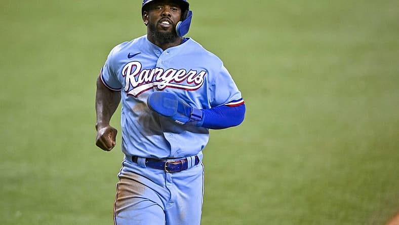Aug 14, 2022; Arlington, Texas, USA; Texas Rangers right fielder Adolis Garcia (53) scores against the Seattle Mariners during the seventh inning at Globe Life Field. Mandatory Credit: Jerome Miron-USA TODAY Sports