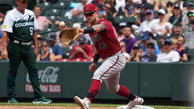 Aug 14, 2022; Denver, Colorado, USA; Arizona Diamondbacks first baseman Christian Walker (53) fields the ball in the fourth inning against the Colorado Rockies at Coors Field. Mandatory Credit: Ron Chenoy-USA TODAY Sports