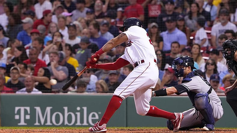 Aug 14, 2022; Boston, Massachusetts, USA; Boston Red Sox left fielder Tommy Pham (22) hits a single against the New York Yankees during the third inning at Fenway Park. Mandatory Credit: Gregory Fisher-USA TODAY Sports