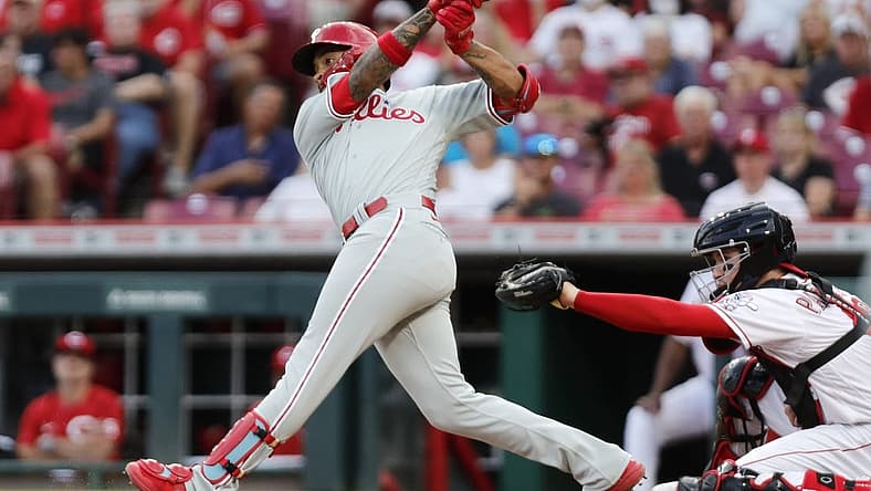Aug 15, 2022; Cincinnati, Ohio, USA; Philadelphia Phillies third baseman Edmundo Sosa (33) hits a two-run single against the Cincinnati Reds during the third inning at Great American Ball Park. Mandatory Credit: David Kohl-USA TODAY Sports